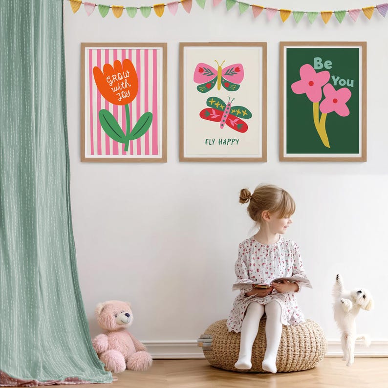 May include: Three framed art prints with botanical and inspirational designs. The first print features a tulip with the text "Grow with Joy." The second print shows two butterflies with the text "Fly Happy." The third print displays flowers with the text "Be You."