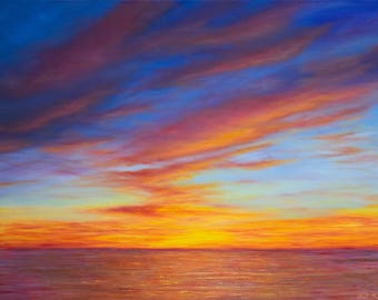 May include: An oil painting depicting a vibrant sunset over the ocean. The sky transitions from deep blue to fiery orange and red hues, with soft clouds. The water reflects the warm colors of the sky.