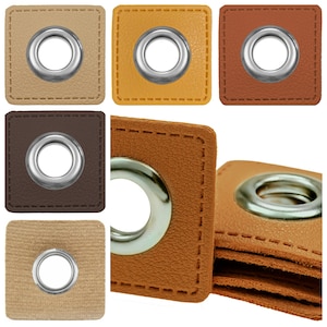 Può includere: Assortimento di sei occhielli quadrati in tessuto con occhielli in metallo in vari colori, tra cui beige, marrone, beige e giallo.
