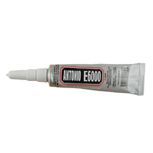 May include: A silver tube of clear adhesive with a white applicator tip. The tube is labeled "ANTONIO E6000" and "The All-Purpose Adhesive".
