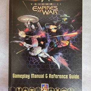May include: A Star Trek: Starfleet Command Volume II: Empires at War gameplay manual and reference guide. The cover features a space battle scene with starships and the game's title in gold lettering. The manual is a vintage collectible.