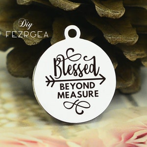 May include: White round metal charm with a black arrow and the text "Blessed Beyond Measure".