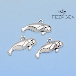 25PCS--24x13mm, Antique silver manatee charms. sea life pendants.