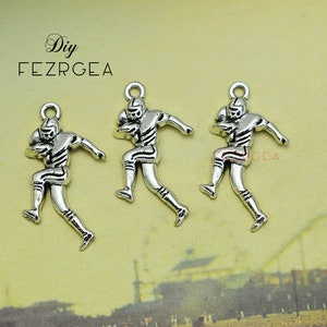 20PCS Antique silver Football Player charms. Sports pendants. CY349