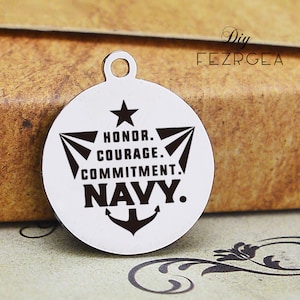 May include: A silver round charm with a black anchor, star, and text that reads "Honor. Courage. Commitment. Navy."