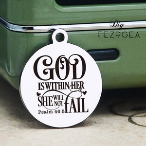 May include: A round silver charm with the text "GOD IS WITHIN HER SHE WILL NOT FAIL" and "Psalm 46:5" in black lettering.