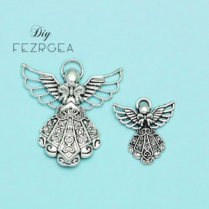 Antique silver plate Angels charms. Fairy pendants.