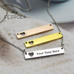 May include: A silver chain necklace with three bar pendants. The top pendant is rose gold, the middle pendant is gold, and the bottom pendant is silver with the text "Your Text Here".