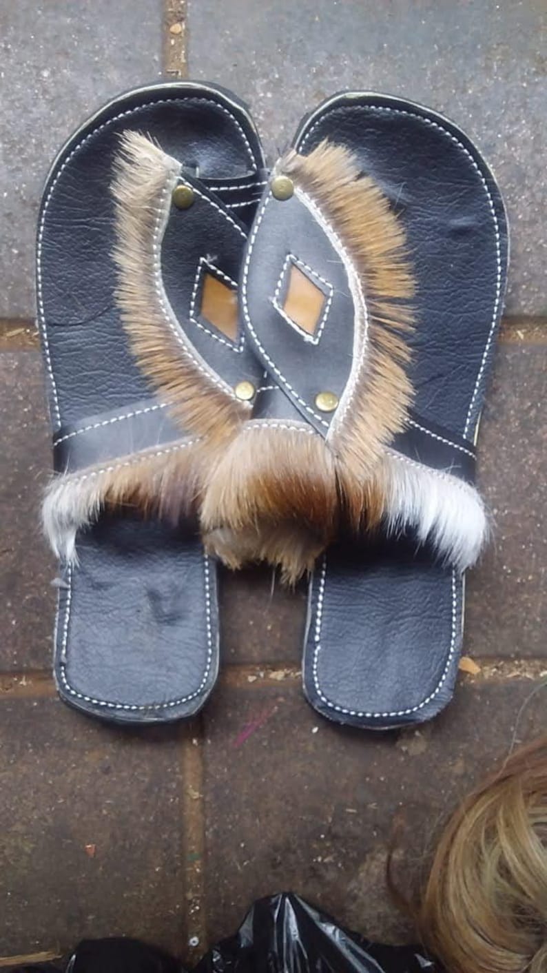 Handcrafted Zulu Imbadada sandals made from genuine springbok hide, traditional African footwear with historical significance.