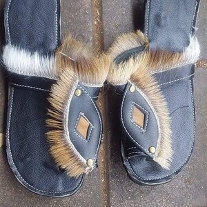 Handcrafted Zulu Imbadada sandals made from genuine springbok hide, traditional African footwear with historical significance.
