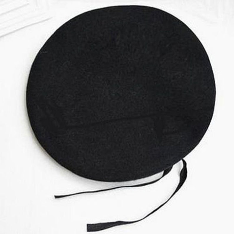 black beret with leather trim