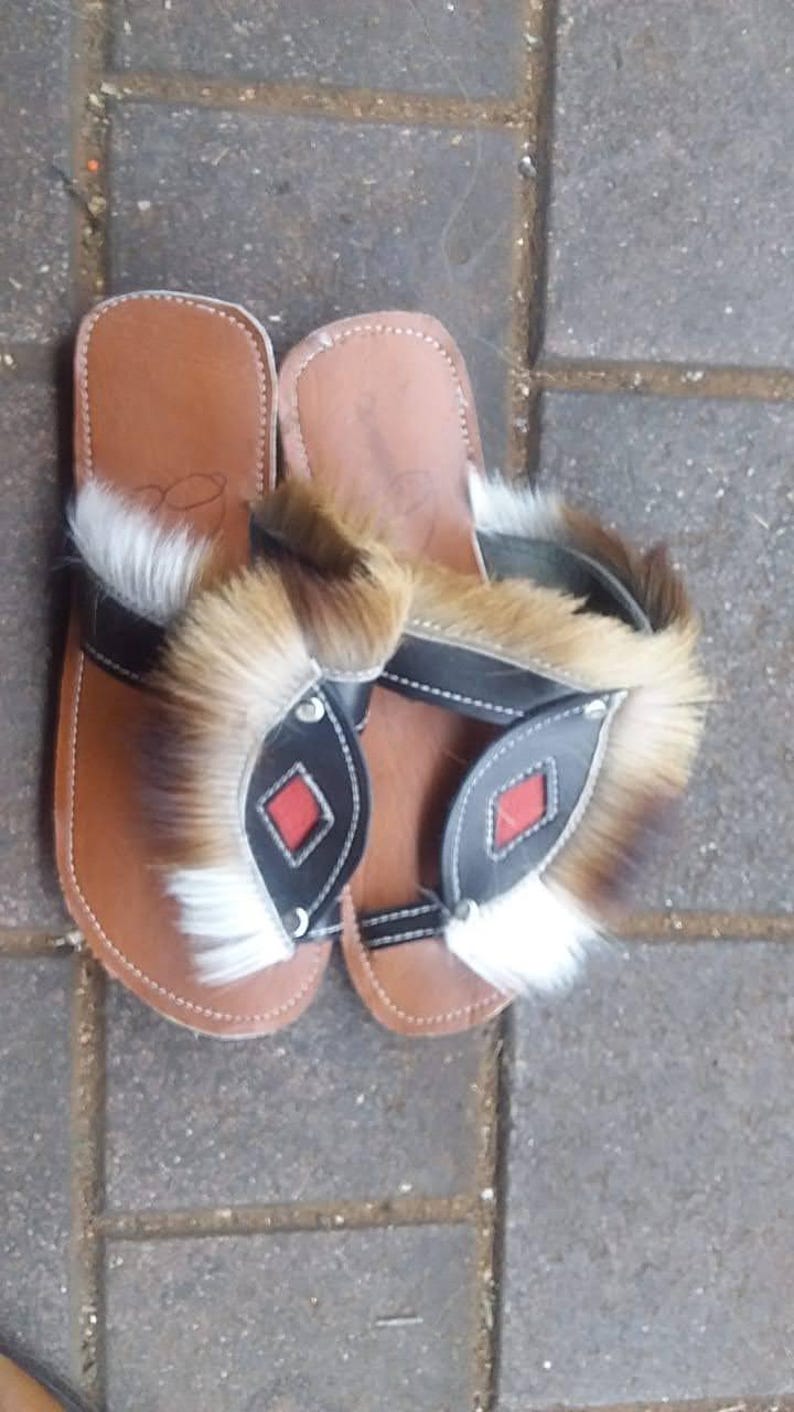 Handcrafted Zulu Imbadada sandals made from genuine springbok hide, traditional African footwear with historical significance.