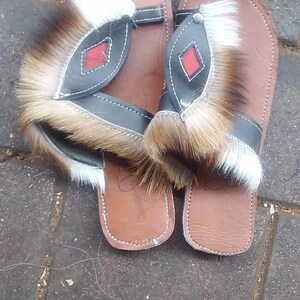Handcrafted Zulu Imbadada sandals made from genuine springbok hide, traditional African footwear with historical significance.