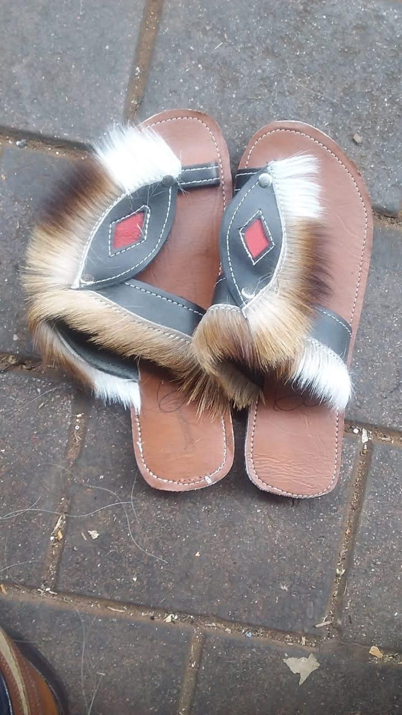 Handcrafted Zulu Imbadada sandals made from genuine springbok hide, traditional African footwear with historical significance.