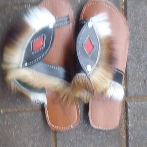Handcrafted Zulu Imbadada sandals made from genuine springbok hide, traditional African footwear with historical significance.