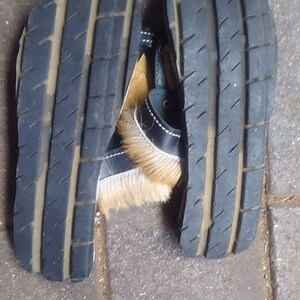 Handcrafted Zulu Imbadada sandals made from genuine springbok hide, traditional African footwear with historical significance.