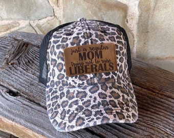 Just a Regular Mom Trying Not to Raise Liberals Leather Leopard Engraved Hat