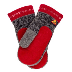 May include: A pair of gray and red knitted mittens with a red leather palm. The mittens have a white and red patterned trim. The mittens have a yellow warning label that says "Warning: Very Warm!"
