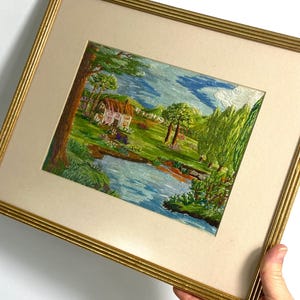 Vintage Embroidered Picture - Pretty embroidered cottage in flower garden picture - gold frame - colourful embroidery - 11” x 12.5” GC