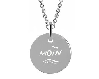 May include: Silver necklace with a round pendant that says "MOIN" with a stylized seagull and waves.