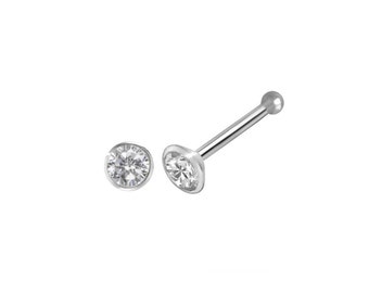 May include: A silver nose ring with a clear round gemstone.