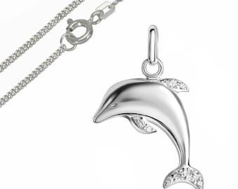 May include: A silver dolphin pendant with a matching chain. The dolphin is detailed with small, clear gemstones on its fins and tail. The chain has a lobster clasp.