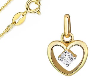 May include: A gold-colored pendant necklace featuring a heart-shaped design. The pendant has a diamond-like stone in the center. The necklace chain and clasp are also gold-colored.