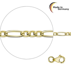 Può includere: Una collana a catena Figaro color oro con chiusura a moschettone. La catena presenta un motivo di maglie allungate e circolari. L'immagine include una vista ravvicinata della catena e della chiusura, con il testo "Made in Germany".