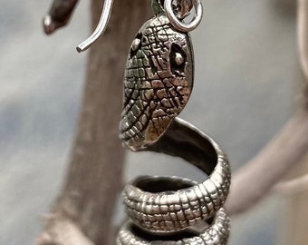 Very beautiful, unusual earrings made of silver in the shape of snakes
