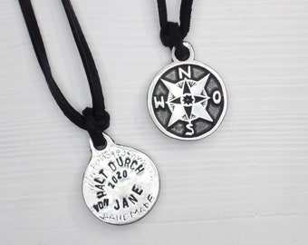 Compass pendant on leather strap