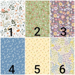 May include: Six different floral fabric swatches with numbers 1 through 6 printed on them. The fabrics feature various floral patterns in shades of blue, green, yellow, pink, and purple.