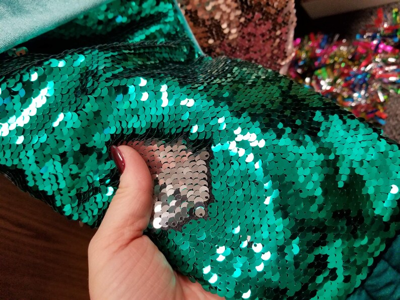 Whimsical Christmas stockings shaped like mermaid tails in green or pink velvet with matching sequins and can be personalized