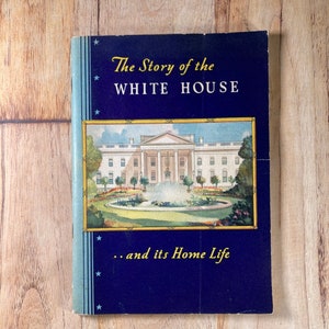 May include: A vintage book cover with a blue background and gold stars. The title is "The Story of the WHITE HOUSE... and its Home Life". The cover features a color illustration of the White House.
