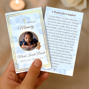 May include: A memorial card featuring a baby's photo, a teddy bear, and the name Micah Isaiah Bennet. The card has a gold border and a blue watercolour background with the text "In Sweet Memory".