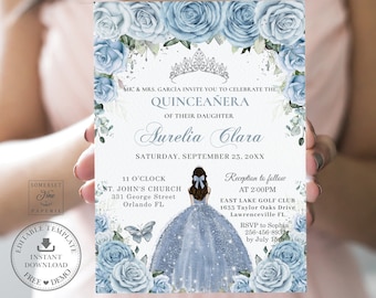 May include: Blue and white Quinceañera invitation with a watercolor floral design. The invitation features a crown, a girl in a blue dress, and the text "MR. & MRS. GARCÍA INVITE YOU TO CELEBRATE THE QUINCEAÑERA OF THEIR DAUGHTER AURELIA CLARA SATURDAY, SEPTEMBER 23, 20XX".