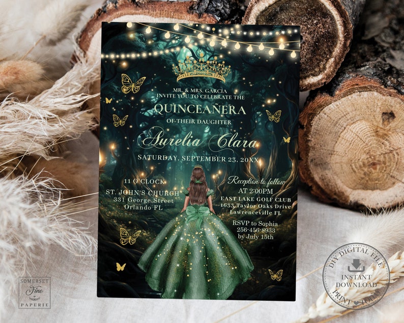 May include: A Quincea&ntilde;era invitation with a green and gold color scheme. The invitation features a fairy tale forest scene with a young woman in a green gown and a crown. The text reads "MR. & MRS. GARCIA INVITE YOU TO CELEBRATE THE QUINCEA&Ntilde;ERA OF THEIR DAUGHTER AURELIA CLARA SATURDAY, SEPTEMBER 23, 20XX".
