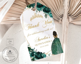 May include: A gold and green thank you tag with a floral design and a crown. The tag says "Thank You for celebrating with us! Aurelia's Quinceañera 08.25.20XX".