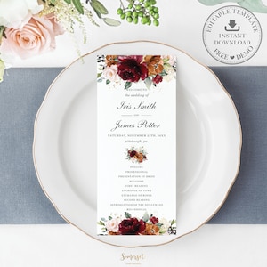 May include: Wedding ceremony order of service card with a burgundy, peach, and gold floral design. The card includes the names Iris Smith and James Potter, the date Saturday, November 25th, 20XX, and the location Pittsburgh, PA. The card also lists the order of the ceremony, including the prelude, processional, presentation of the bride, welcome, first reading, exchange of vows, exchange of rings, second reading, introduction of the newlyweds, and recessional.