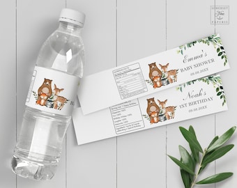 May include: Water bottle label with a woodland theme. The label features a brown bear, a deer, a fox, and a raccoon. The text on the label reads "Emma's Baby Shower 09.08.20XX" and "Noah's 1st Birthday 09.08.20XX".