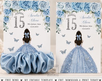May include: Two rectangular card holders for scrunchies featuring a blue rose floral border, a silver glitter number 15, and an illustration of a person in a blue glitter gown. The text reads Aurelia Clara, Mis Quince Años, and 03.05.20XX.