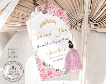 May include: A white thank you tag with gold accents and pink floral designs. The tag features a gold crown, the text "Thank You for celebrating with us!" and the name "Aurelia's Quinceañera" with the date "08.25.20XX".
