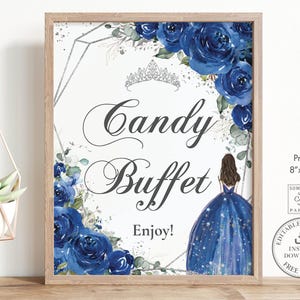 May include: A rectangular sign in a light wood frame featuring the text Candy Buffet Enjoy! with a silver tiara graphic, deep blue watercolor roses, and an illustration of a person in a dark blue gown with a starry skirt on a white background.