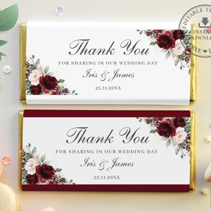 May include: Two white chocolate bar wrappers with burgundy floral designs. The text on the wrappers reads "Thank You for sharing in our wedding day Iris & James 25.11.20XX".