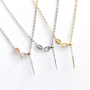 May include: Three delicate gold chains with adjustable lengths. The chains are in silver, gold, and rose gold.