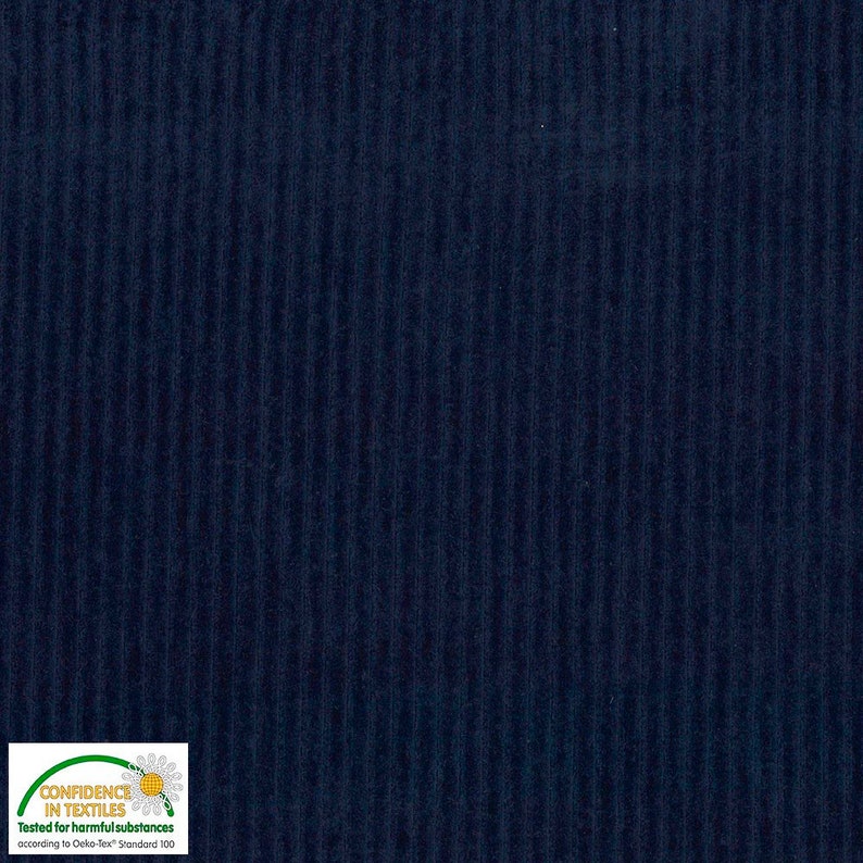 May include: Close-up of navy blue corduroy fabric with vertical ribbed texture. The fabric has a soft, velvety appearance and a deep, saturated color. The image includes a "Confidence in Textiles" label.