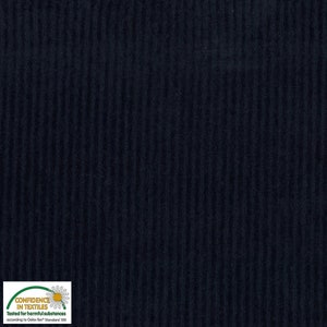May include: Close-up of navy blue corduroy fabric with vertical ribbed texture. The fabric has a soft, matte finish and is suitable for various sewing projects. The image includes a "Confidence in Textiles" label.