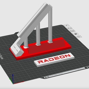 May include: A 3D-rendered model of a computer component stand. The stand is primarily white and red, with a sloped top and three supporting pillars. The word "RADEON" is displayed in red on a white rectangular base.
