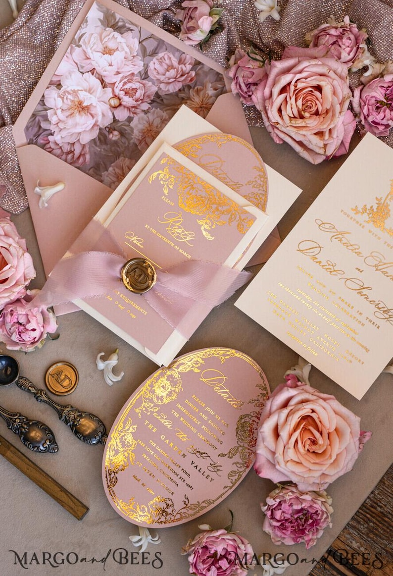 May include: Pink and gold wedding invitation suite with floral details. The invitation features a gold foil design with a floral pattern and the text "Please join us for a dinner and dancing immediately following the wedding ceremony". The details card features a gold foil design with a floral pattern and the text "Details". The RSVP card features a gold foil design with a floral pattern and the text "Please RSVP by the 15th of March".