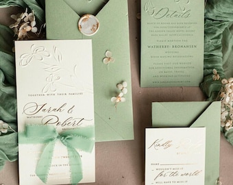 May include: A green and white wedding invitation suite with a floral design. The invitation features the names "Jarah & Robert" and the text "Together with their families". The RSVP card includes a QR code and the text "Kindly RSVP by [date]".