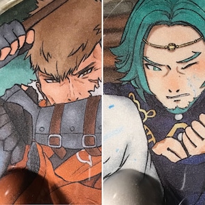 May include: Two illustrated characters, one with brown hair and a brown leather strap across their chest, the other with teal hair and a gold headband, both with detailed facial features.